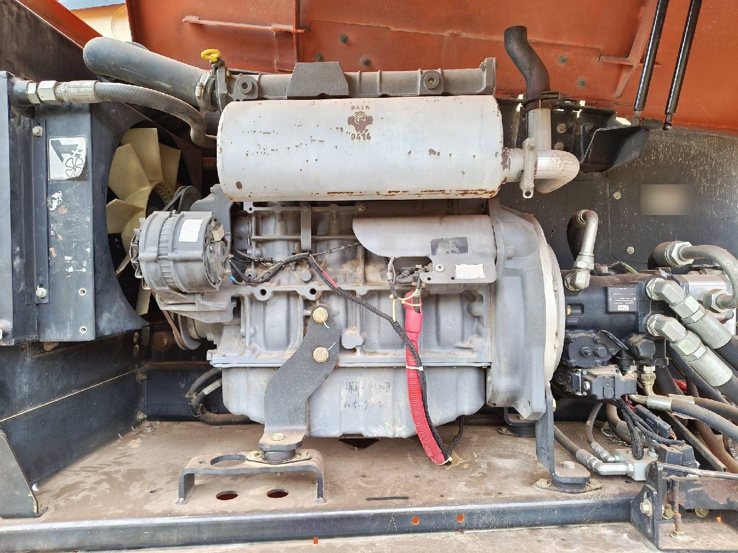 Engine bay of an aerial work platform opened for inspection